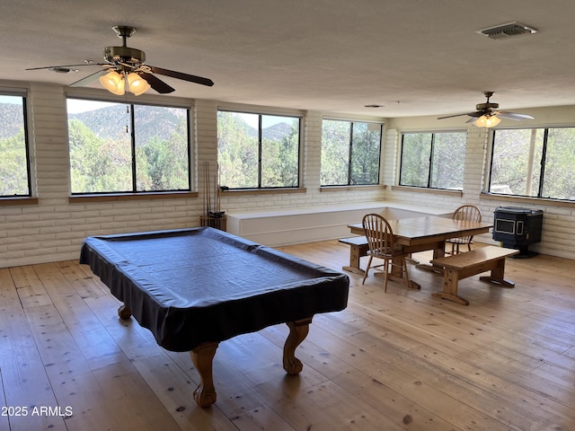 2160 S Moonlight Dr, Star Valley, AZ 85541 - playroom with brick wall, a ceiling fan, plenty of natural light, light wood-style floors, and billiards