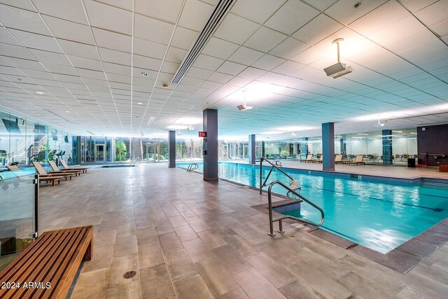 exercise room with light hardwood / wood-style flooring