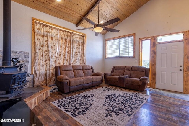 24 N County Road N3101, Vernon, AZ 85940 - living room with beamed ceiling, a ceiling fan, hardwood / wood-style floors, wooden ceiling, and a wood stove