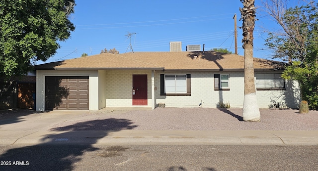 ranch-style home with a garage