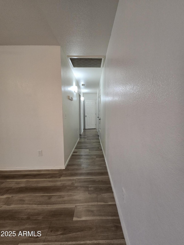 hallway with dark wood-type flooring