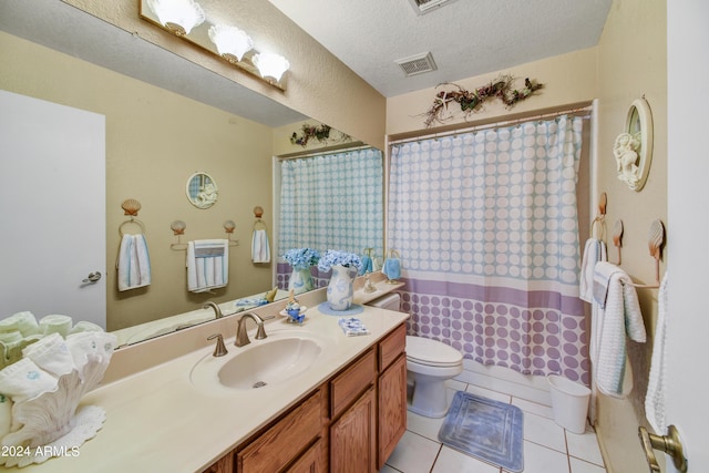 11630 N 74th Dr, Peoria, AZ 85345 - bathroom with a textured ceiling, visible vents, toilet, vanity, and tile patterned flooring