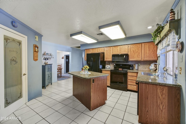 11630 N 74th Dr, Peoria, AZ 85345 - kitchen with a sink, a kitchen island, light tile patterned floors, visible vents, and black appliances