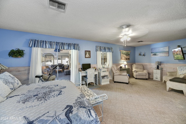 11630 N 74th Dr, Peoria, AZ 85345 - carpeted bedroom featuring visible vents, a ceiling fan, and a textured ceiling
