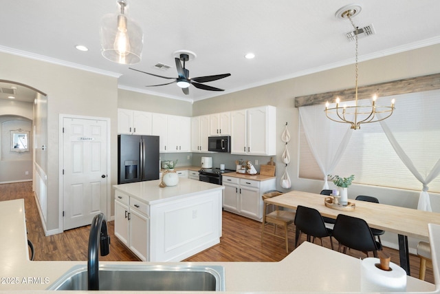 10722 E Keats Ave, Mesa, AZ 85209 - kitchen featuring white cabinets, black appliances, visible vents, arched walkways, and a sink