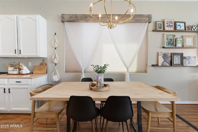 10722 E Keats Ave, Mesa, AZ 85209 - dining area with light wood-style flooring, a chandelier, and baseboards