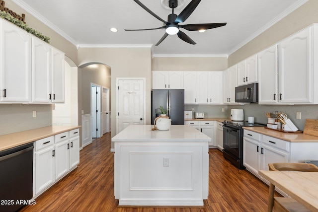 10722 E Keats Ave, Mesa, AZ 85209 - kitchen with white cabinets, arched walkways, black appliances, and ceiling fan