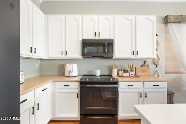 10722 E Keats Ave, Mesa, AZ 85209 - kitchen with white cabinetry, light countertops, decorative backsplash, and appliances with stainless steel finishes