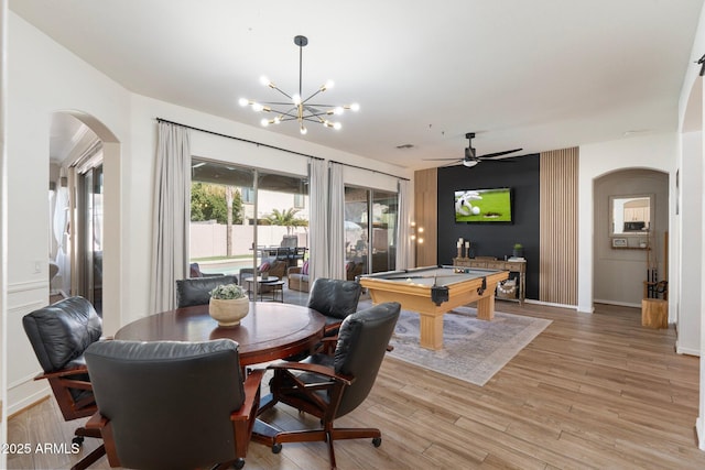 10722 E Keats Ave, Mesa, AZ 85209 - dining space with light wood-style floors, ceiling fan with notable chandelier, pool table, arched walkways, and baseboards