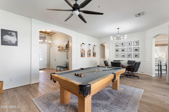 10722 E Keats Ave, Mesa, AZ 85209 - recreation room with arched walkways, ceiling fan with notable chandelier, light wood finished floors, and visible vents