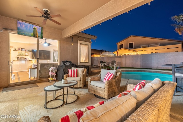10722 E Keats Ave, Mesa, AZ 85209 - patio at night with a fenced backyard, ceiling fan, and an outdoor hangout area