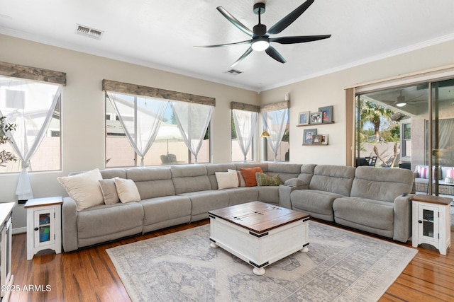 10722 E Keats Ave, Mesa, AZ 85209 - living area featuring wood finished floors, a ceiling fan, and plenty of natural light