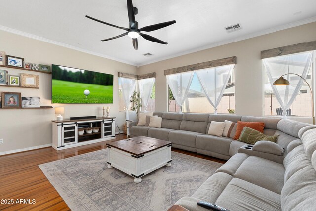 10722 E Keats Ave, Mesa, AZ 85209 - living room featuring ceiling fan, ornamental molding, visible vents, wood finished floors, and baseboards