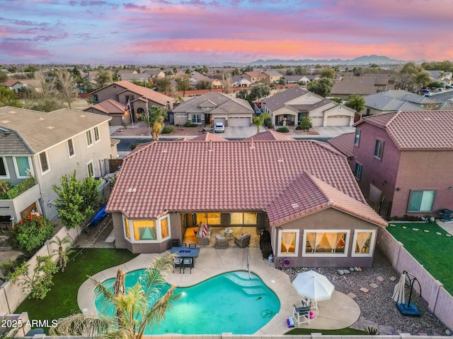 10722 E Keats Ave, Mesa, AZ 85209 - back of house featuring a tiled roof, a patio area, a fenced backyard, a fenced in pool, and a residential view