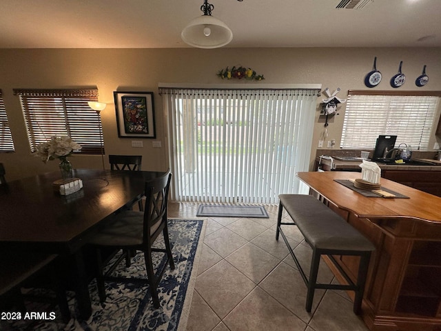 dining room with tile patterned floors