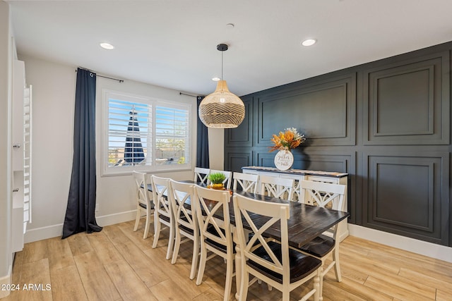 dining space featuring light wood-type flooring