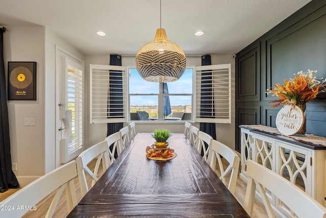 dining room featuring a wealth of natural light and a chandelier