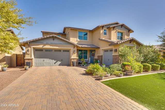 view of front facade featuring a front yard and a garage