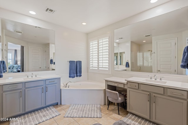 bathroom featuring vanity, independent shower and bath, and tile patterned floors