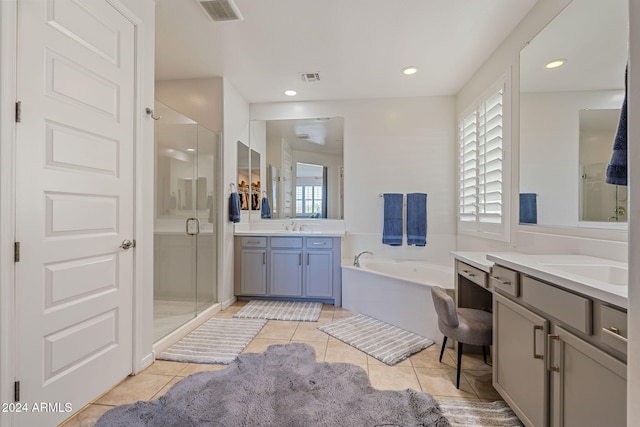 bathroom with vanity, shower with separate bathtub, and tile patterned flooring