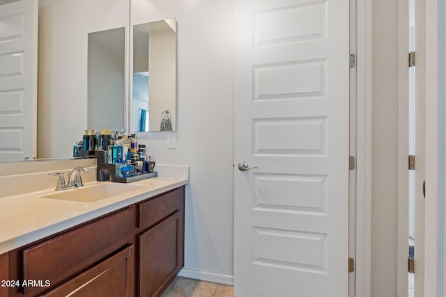 bathroom with vanity and tile patterned floors