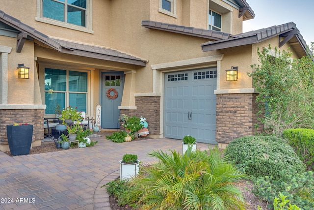 doorway to property featuring a garage