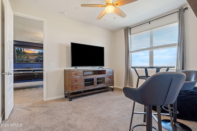 office with light colored carpet and ceiling fan