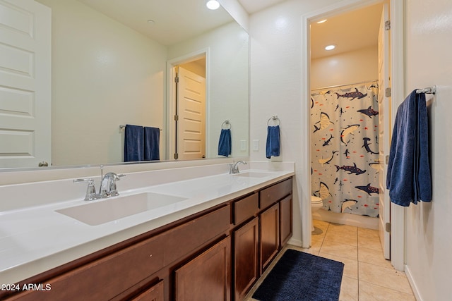 bathroom with toilet, vanity, tile patterned floors, and a shower with shower curtain