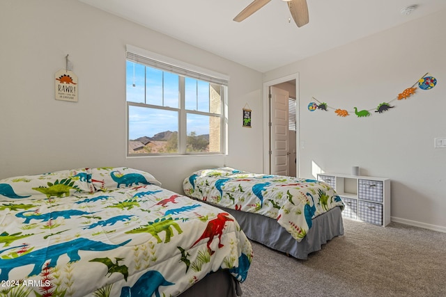 bedroom with ceiling fan and carpet flooring