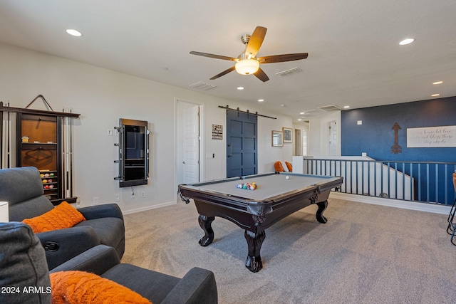 game room featuring pool table, a barn door, light carpet, and ceiling fan