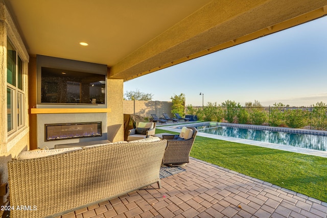 view of patio with a fenced in pool