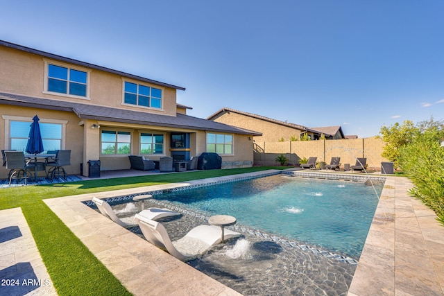 view of pool featuring a patio and pool water feature