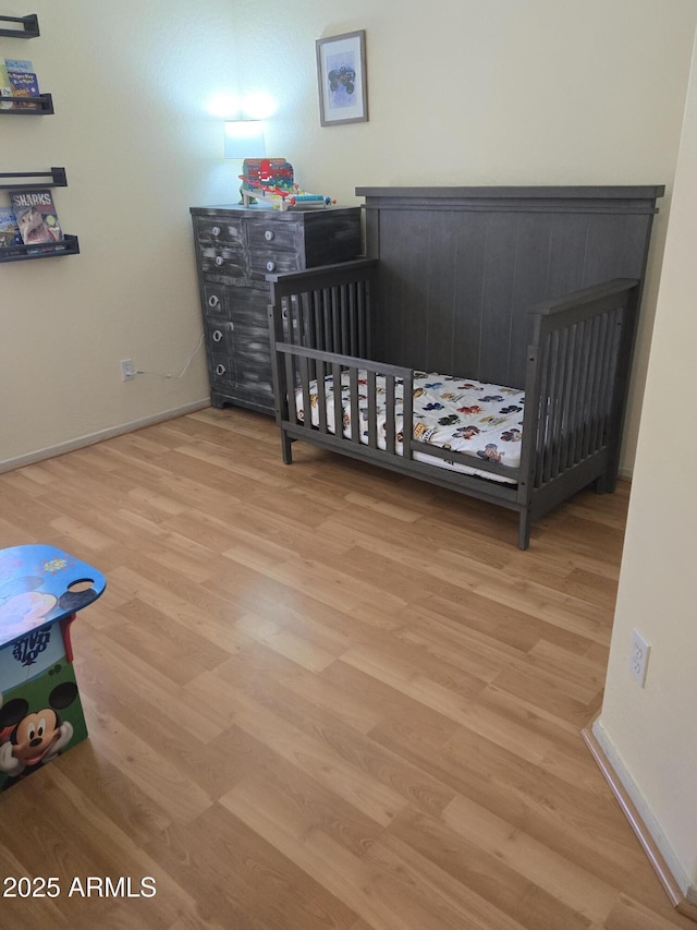 2125 E Danbury Rd, Phoenix, AZ 85022 - bedroom featuring wood finished floors and baseboards