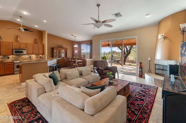 43638 N 22nd St, New River, AZ 85087 - living area with a ceiling fan, recessed lighting, light tile patterned floors, and high vaulted ceiling