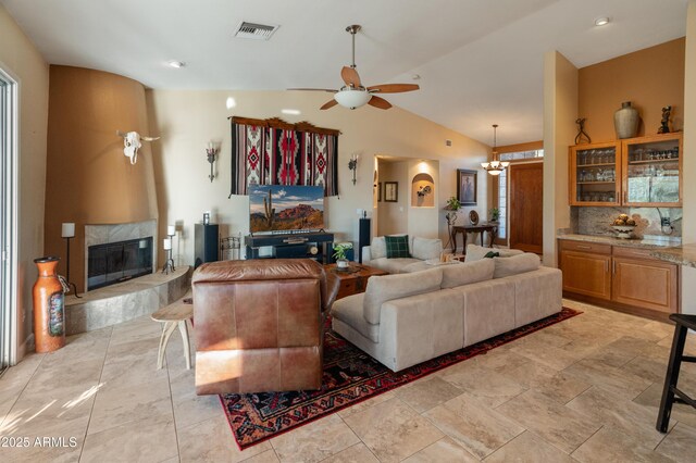 43638 N 22nd St, New River, AZ 85087 - living room with ceiling fan, a premium fireplace, vaulted ceiling, and a chandelier