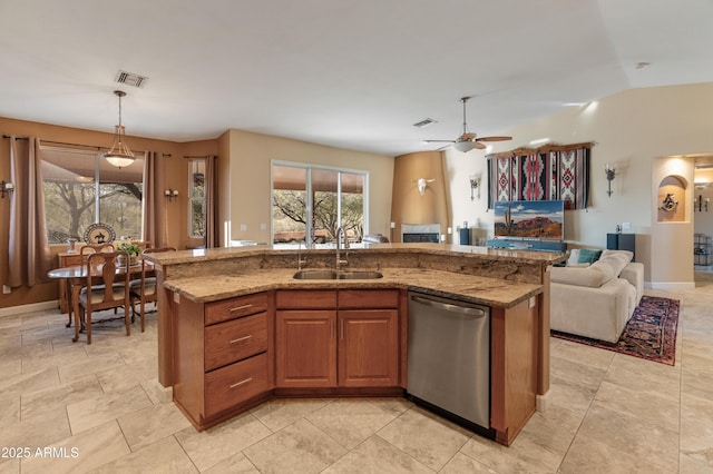 43638 N 22nd St, New River, AZ 85087 - kitchen featuring stainless steel dishwasher, open floor plan, a sink, light stone countertops, and decorative light fixtures