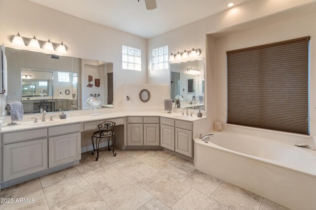 43638 N 22nd St, New River, AZ 85087 - full bathroom with a garden tub, double vanity, a ceiling fan, and tile patterned flooring