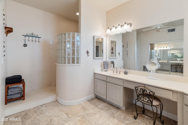 43638 N 22nd St, New River, AZ 85087 - bathroom with a ceiling fan, vanity, a walk in shower, baseboards, and tile patterned flooring