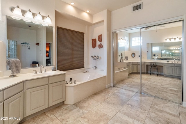 43638 N 22nd St, New River, AZ 85087 - ensuite bathroom featuring vanity, a garden tub, a ceiling fan, and recessed lighting