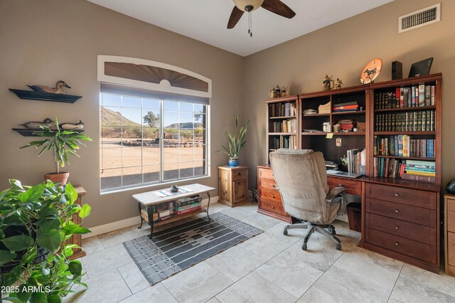 43638 N 22nd St, New River, AZ 85087 - home office with a ceiling fan, baseboards, and light tile patterned floors
