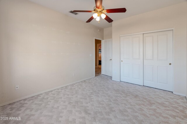 43638 N 22nd St, New River, AZ 85087 - unfurnished bedroom with carpet floors, a closet, baseboards, and a ceiling fan