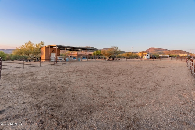 43638 N 22nd St, New River, AZ 85087 - view of yard with an outdoor riding arena, a rural view, an exterior structure, and a mountain view