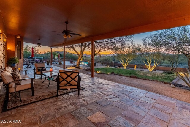 43638 N 22nd St, New River, AZ 85087 - patio terrace at dusk with a patio, a ceiling fan, a fenced backyard, and an outdoor hangout area