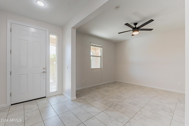 entryway with ceiling fan and light tile patterned floors