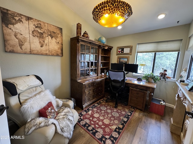 office area featuring dark wood-type flooring and lofted ceiling