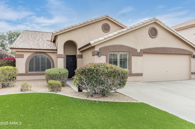 view of front facade with a garage and a front lawn