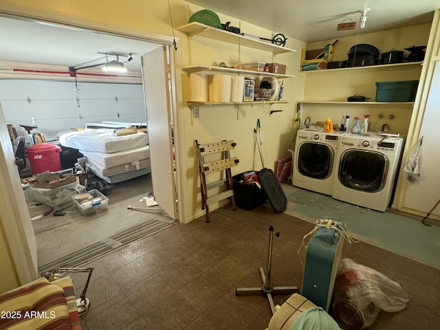 laundry area featuring a garage, laundry area, and separate washer and dryer