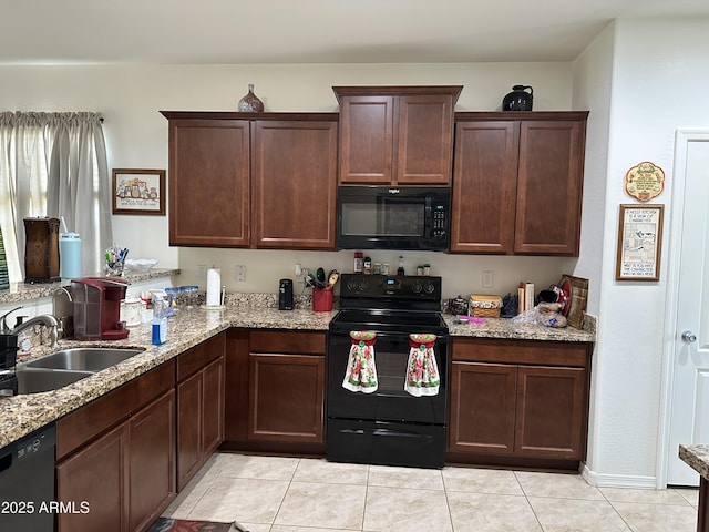 24645 W Atlanta Ave, Buckeye, AZ 85326 - kitchen with black appliances, light tile patterned flooring, light stone countertops, and dark brown cabinetry