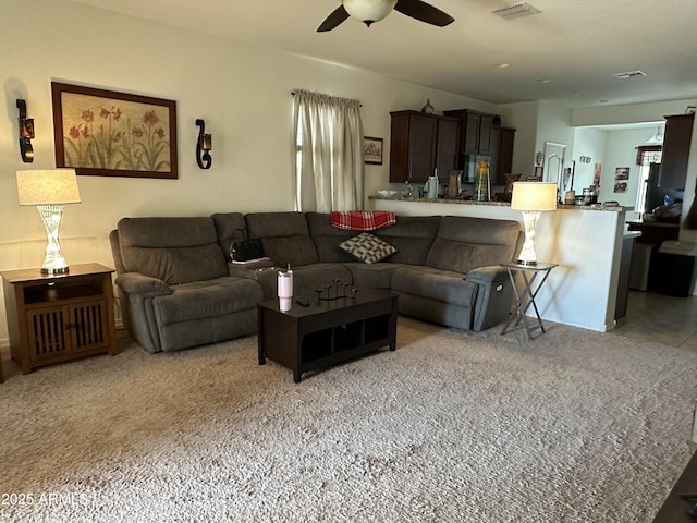 24645 W Atlanta Ave, Buckeye, AZ 85326 - living room featuring a ceiling fan and light carpet