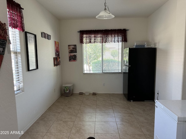 24645 W Atlanta Ave, Buckeye, AZ 85326 - dining space featuring light tile patterned floors and baseboards